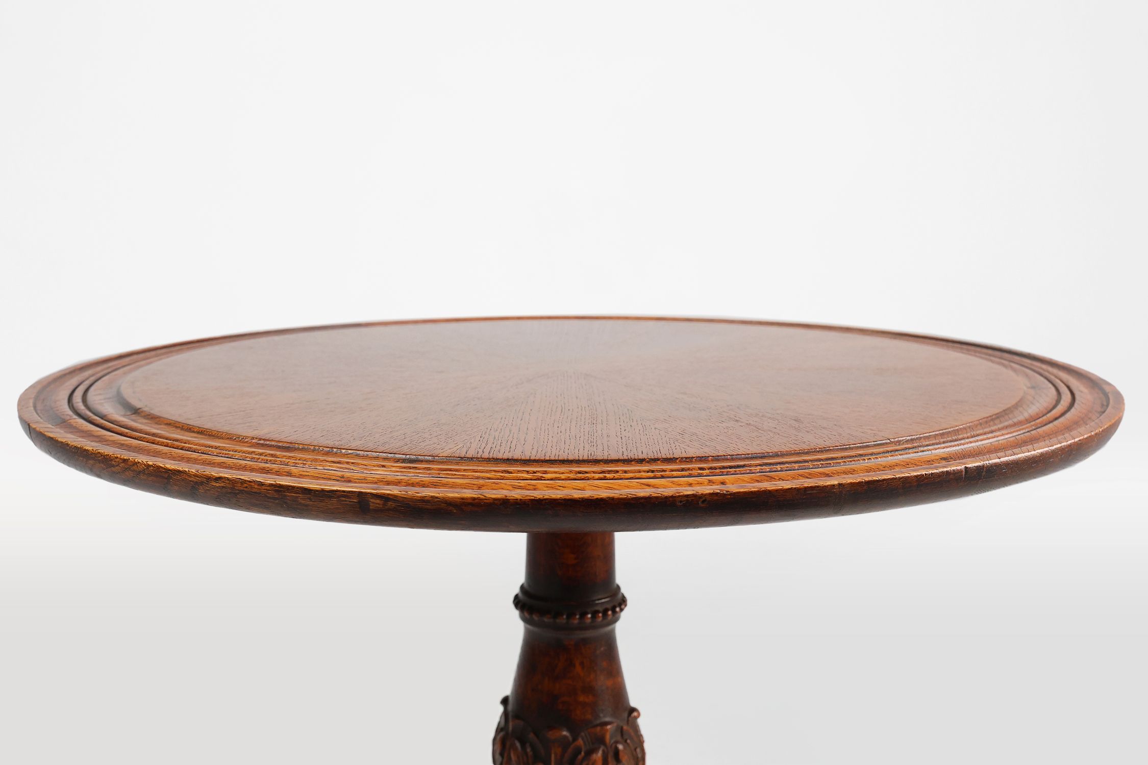 Antique English hand carved circular oak side table with lions head feet thumbnail